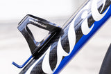 Carbon water bottle cage featuring blue holder and 3K black design